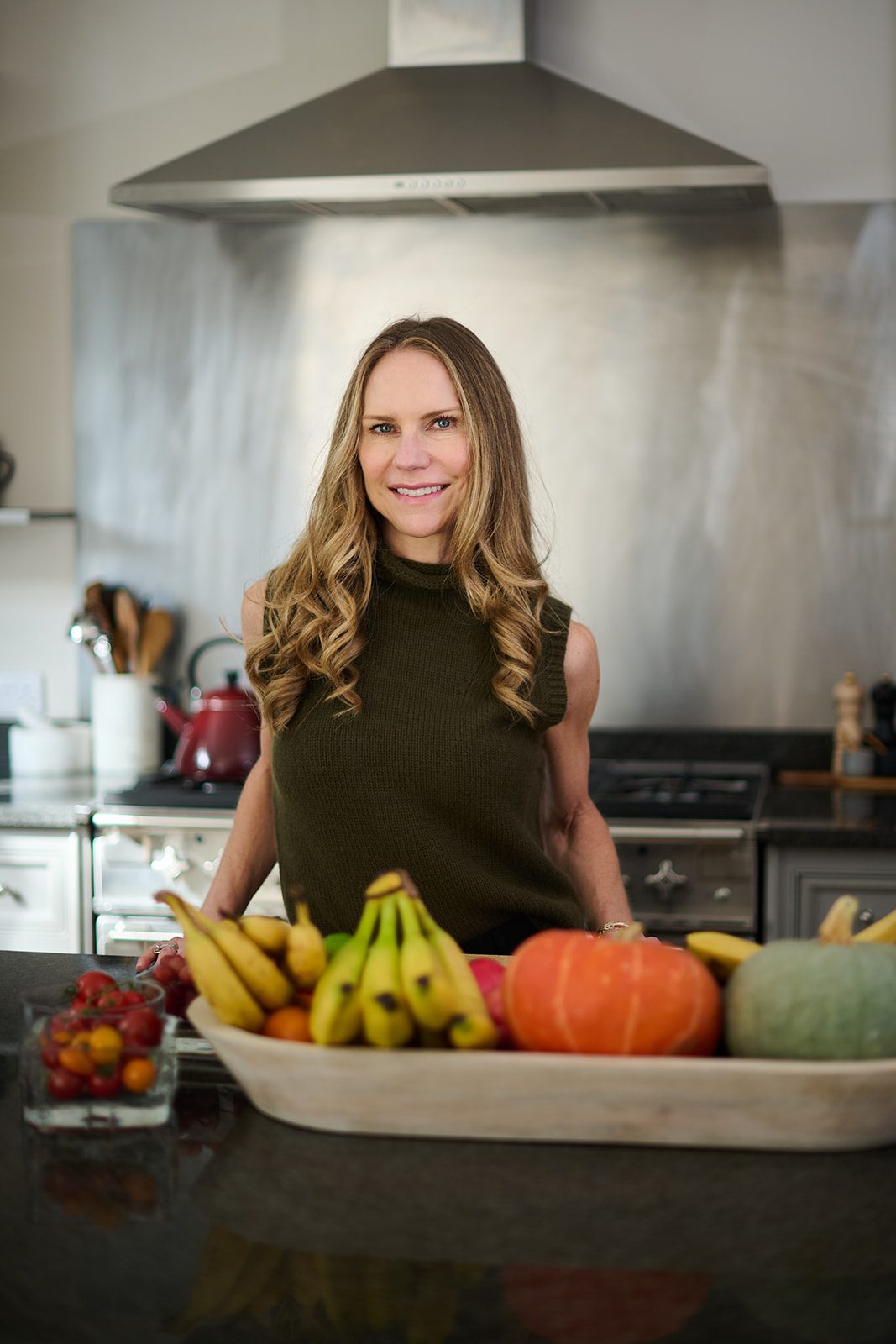 Heidi Nowalany in her kitchen with seasonal produce